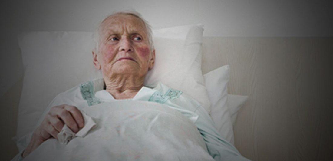 Image of elderly person in bed