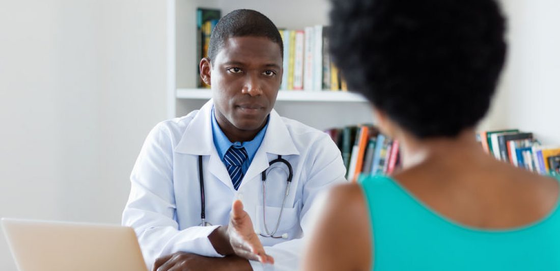 Image of medical professional speaking to woman