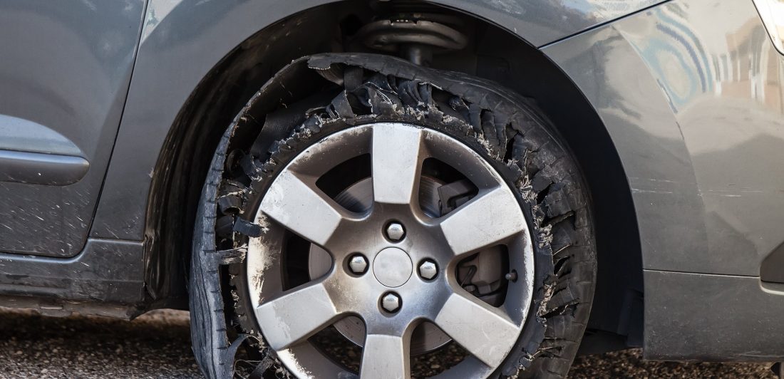 Image of car with a flat tire