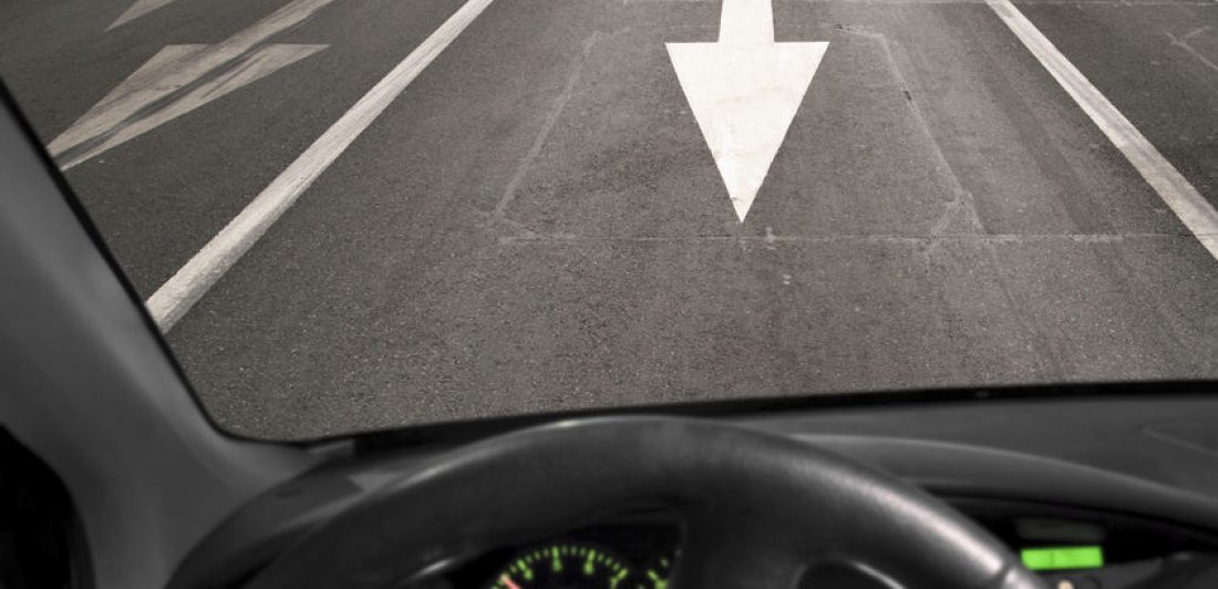 Image of a car driving the wrong way on a road